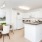 a kitchen with an extended counter top next to a dining area
