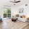 a living room with a couch and large windows