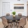 a dining room with a table and chairs