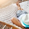 a man sleeping in a hammock