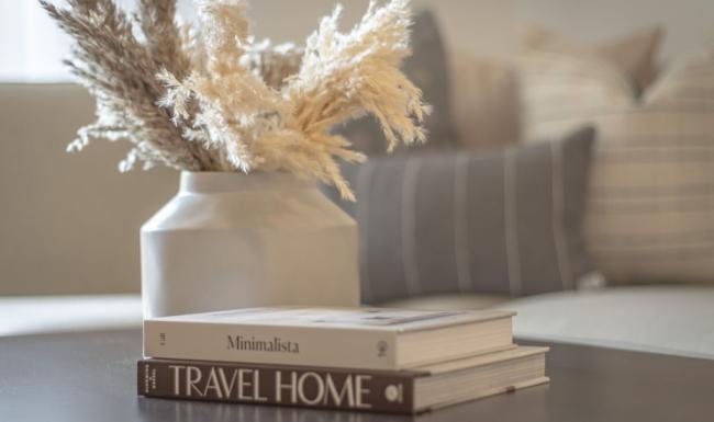 The essence of exceptional living a vase with flowers on a table