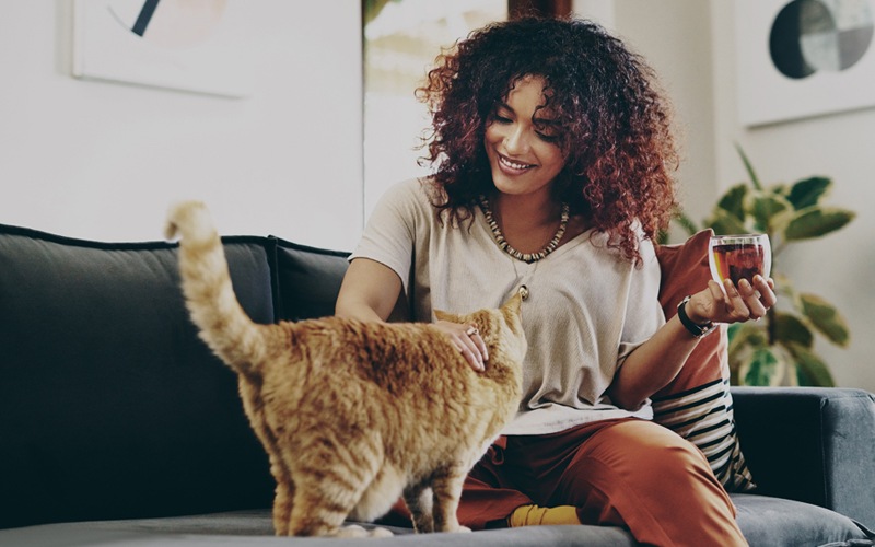 a woman relaxing with her cat