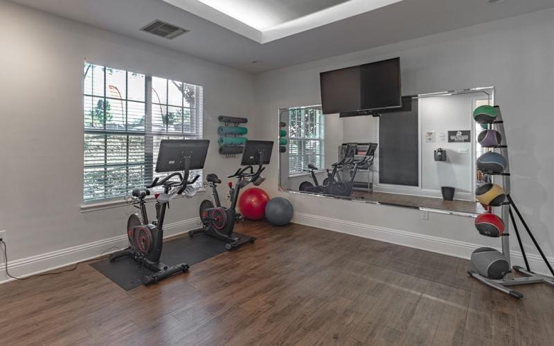 a room with exercise equipment and exercise equipment