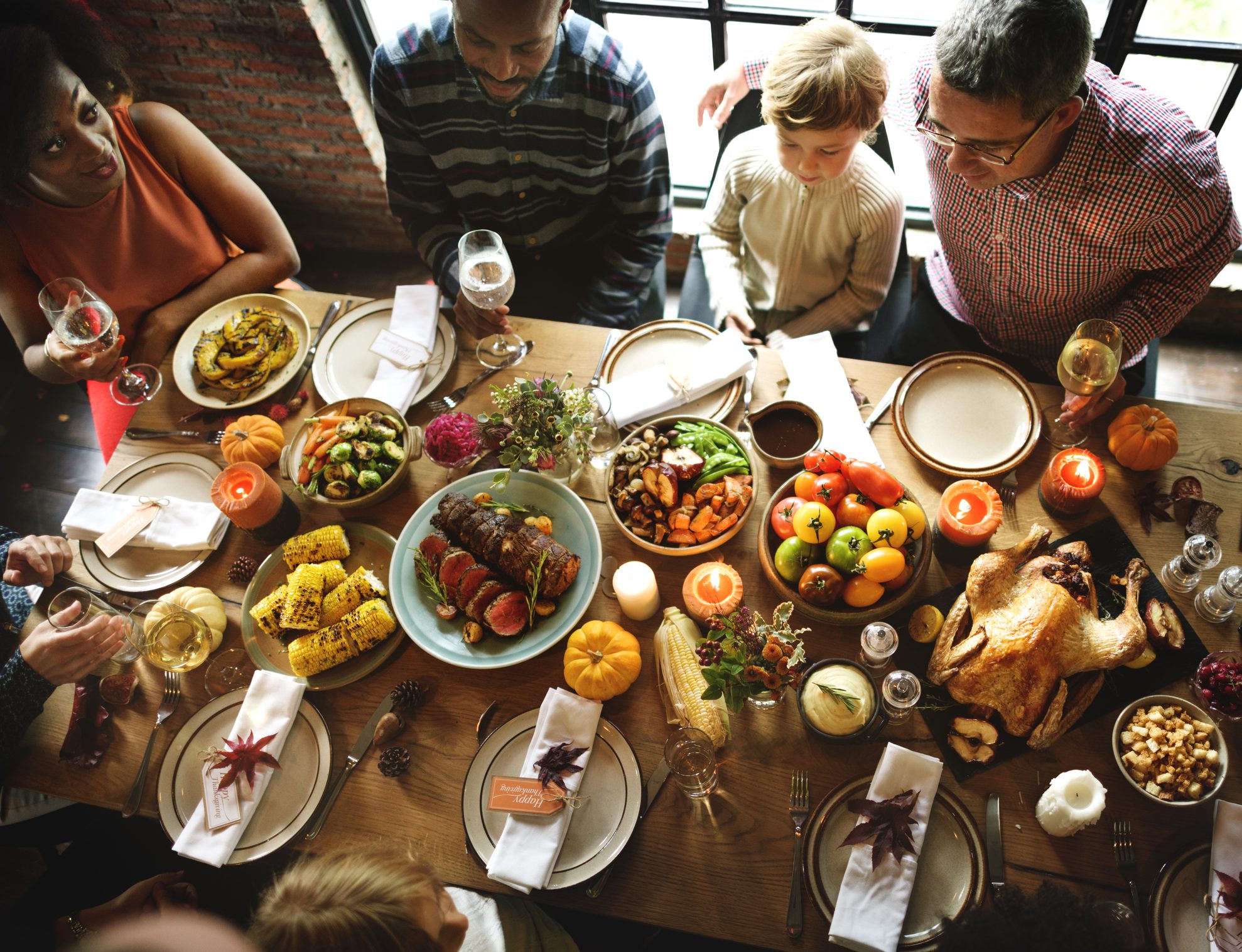 Family gathered around Thanksgiving table