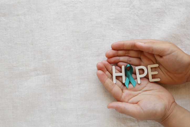 hands holding "hope" for cancer awareness
