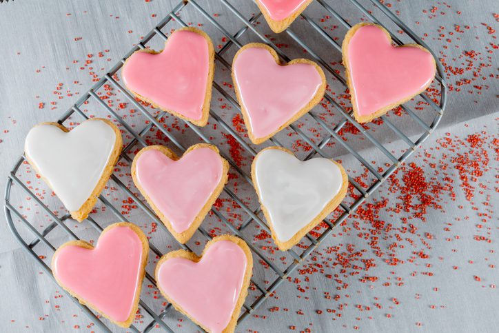 Small Heart Cookies On Cooling Rack over wax paper
