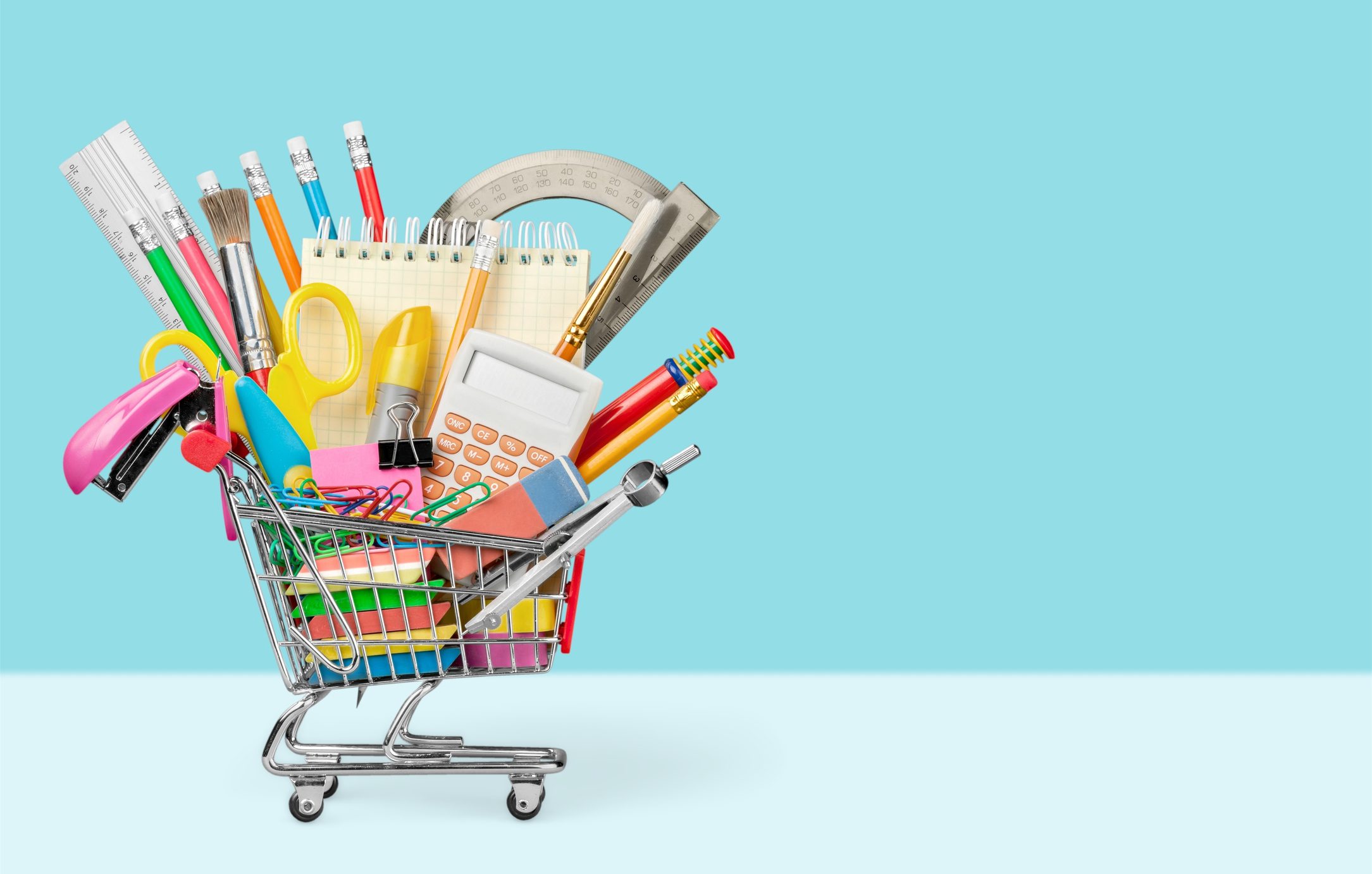 Back to school with shopping cart full of school tools
