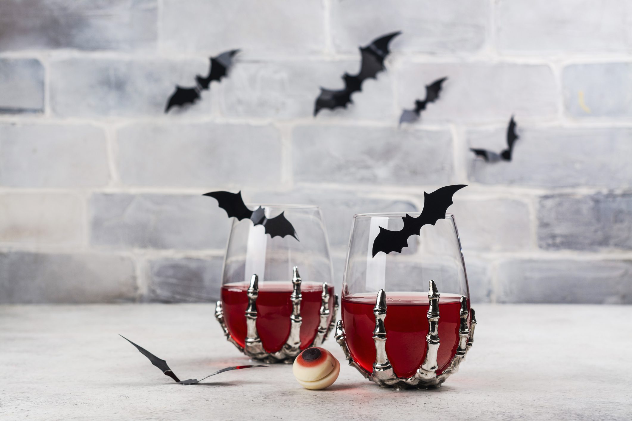 Bloody Halloween party cocktail with bat. Halloween cranberry punch